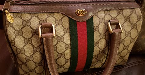 how to tell if a vintage gucci purse is real|old gucci small purses.